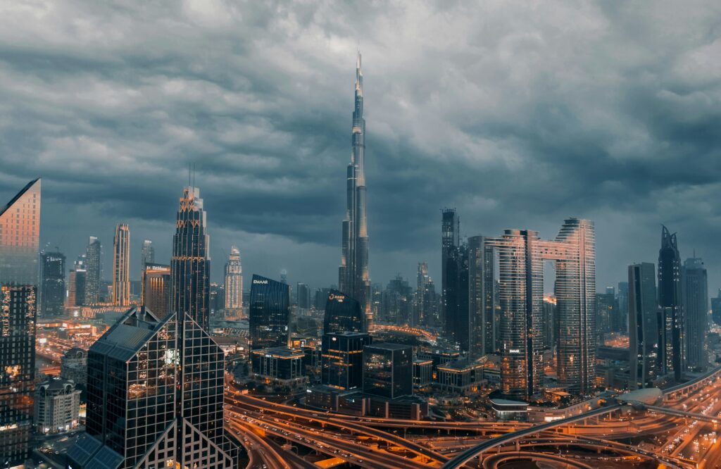 The Mecca Pact Wasn't Really About Iran: Here's Who's Actually Losing Sleep Over It 2 Dubai skyline at dusk with the Burj Khalifa and Downtown Dubai towers under a stormy sky