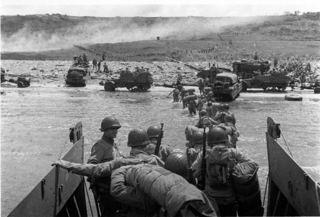 Troops Wading Ashore at Omaha Beach American troops wading ashore at Omaha Beach from a landing craft, June 6, 1944