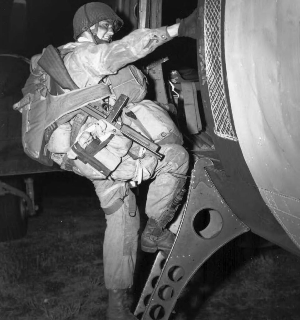 Paratrooper Boarding a C-47, D-Day U.S. paratrooper of the 101st Airborne Division climbing aboard a C-47 before the D-Day airborne assault